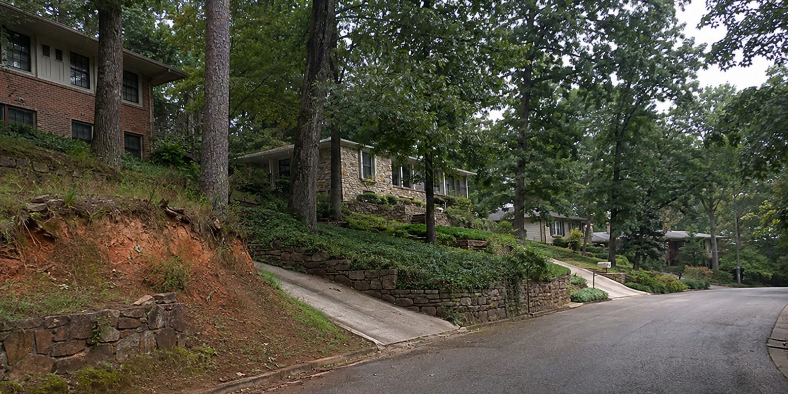 Brick homes stepped into a wooded hillside street in suburban Birmingham, Alabama