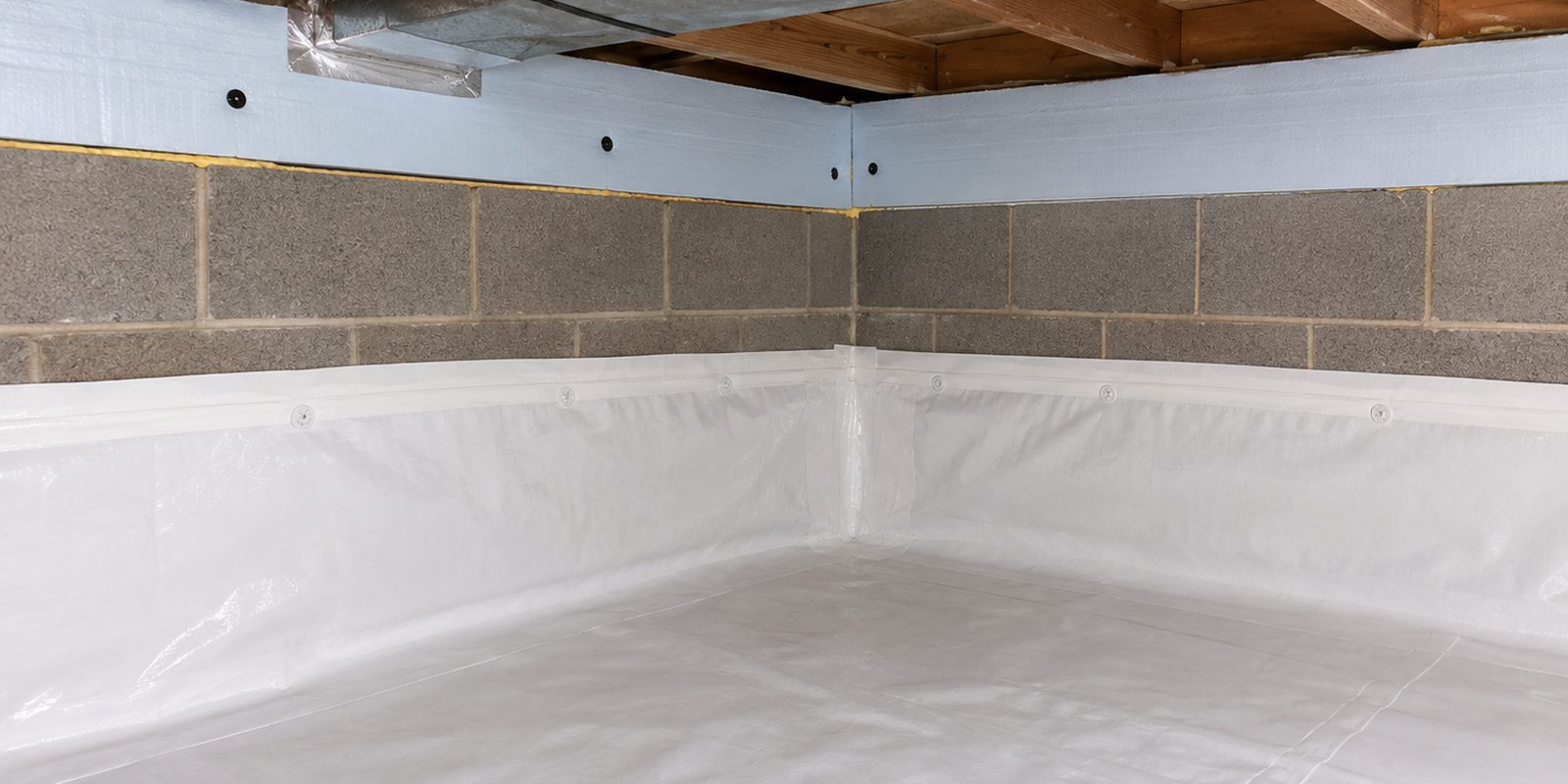 Encapsulated crawl space corner with sealed liner and insulated rim joist in Birmingham, Alabama
